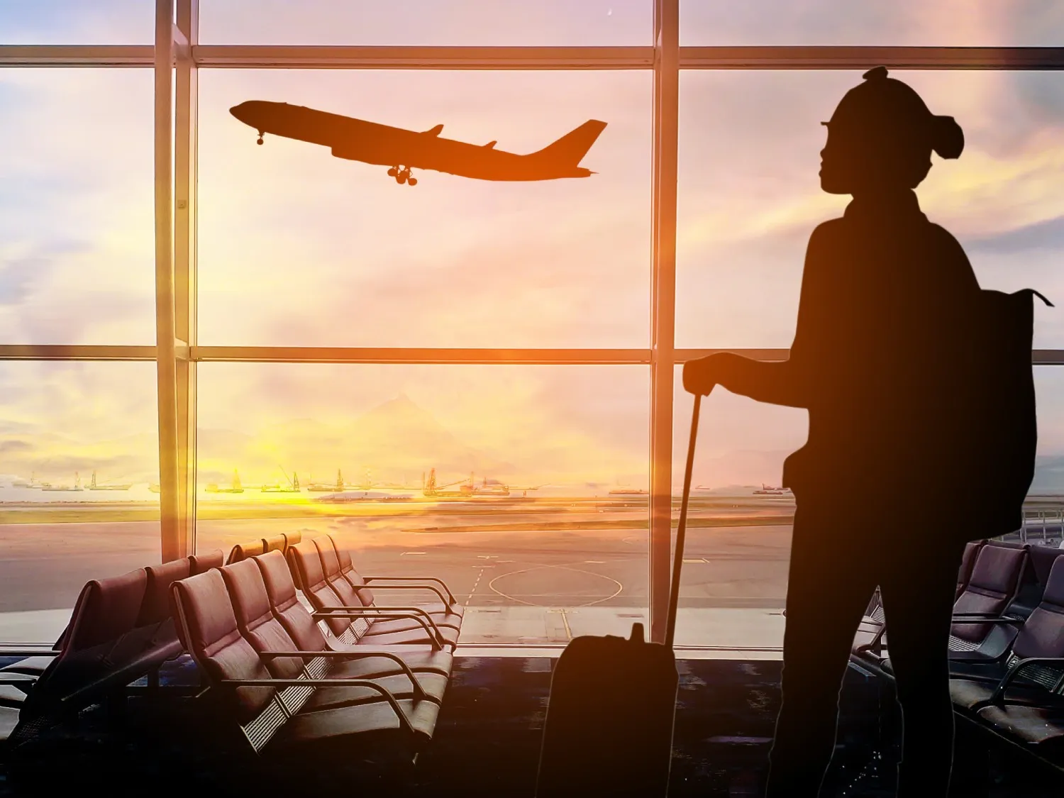Airport lounge with sunset and a passenger