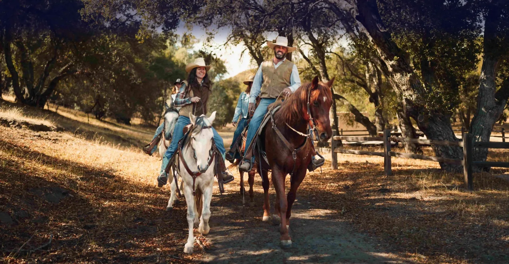 Two people riding horses through the North of SLO CAL